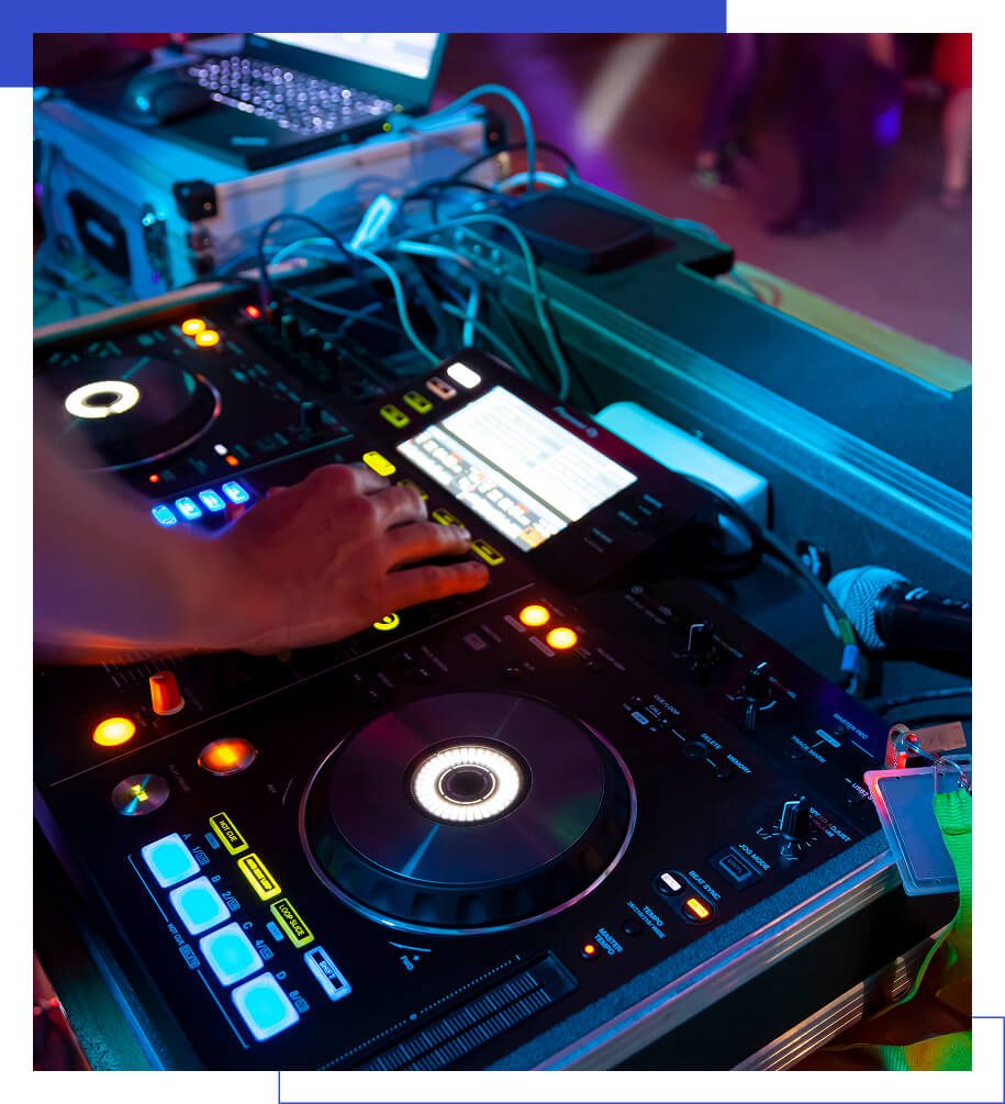 DJ mixing music on a turntable setup.