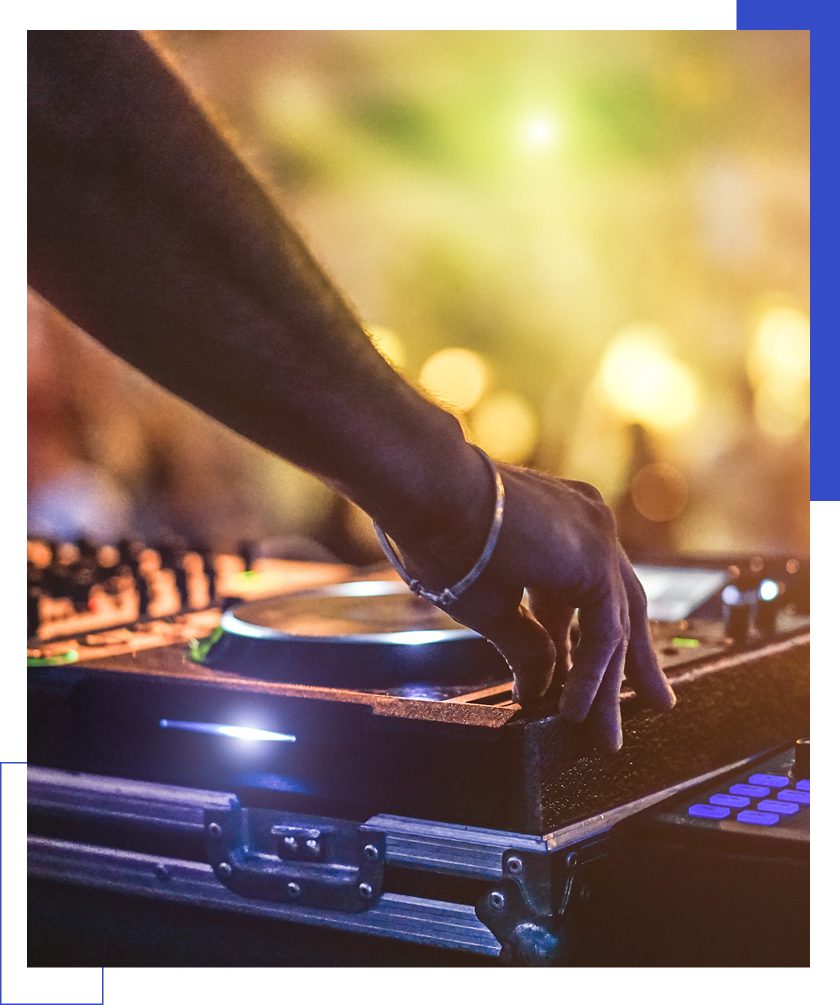 DJ mixing music at a vibrant party.